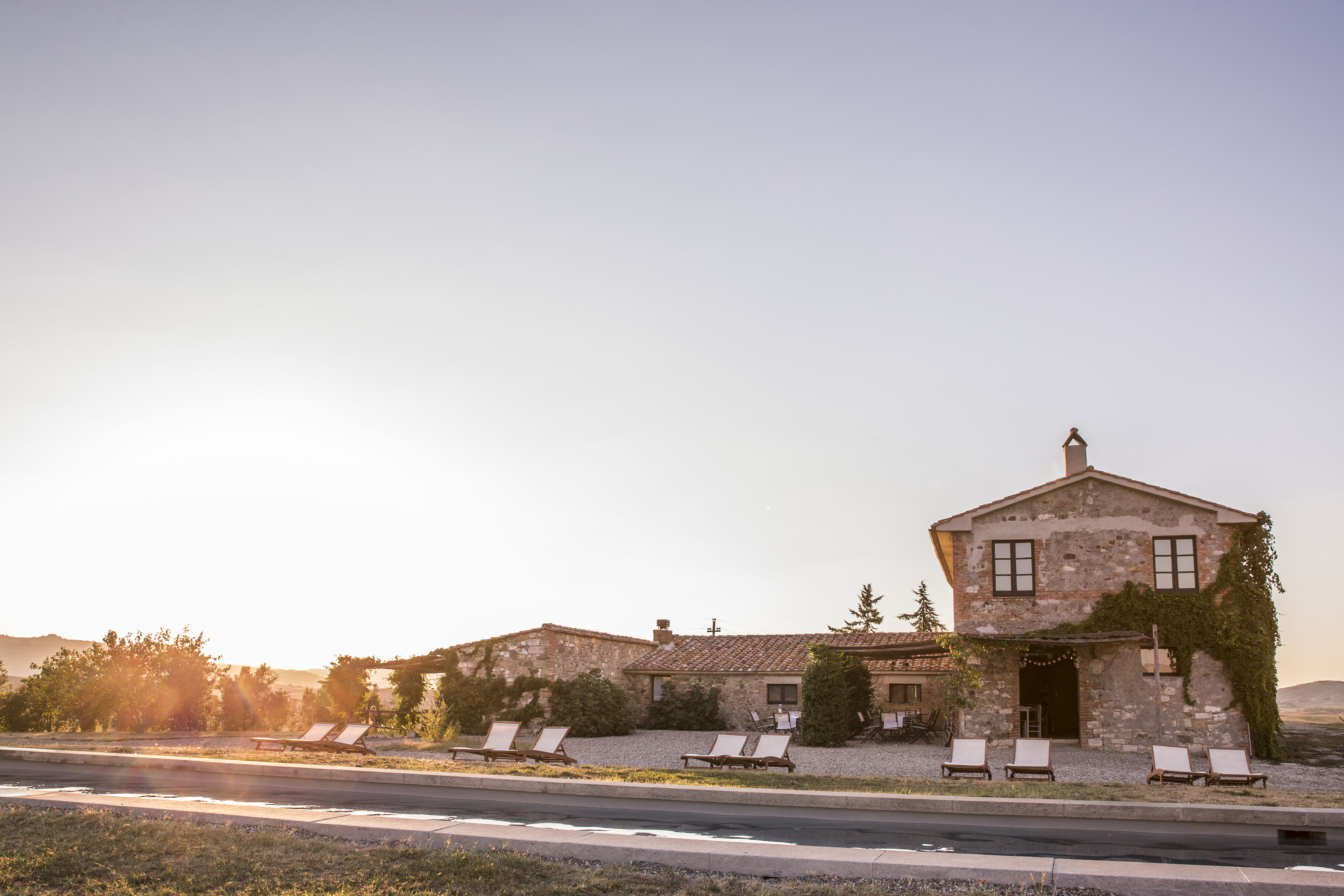 Podere in Castiglione pool area in sunset