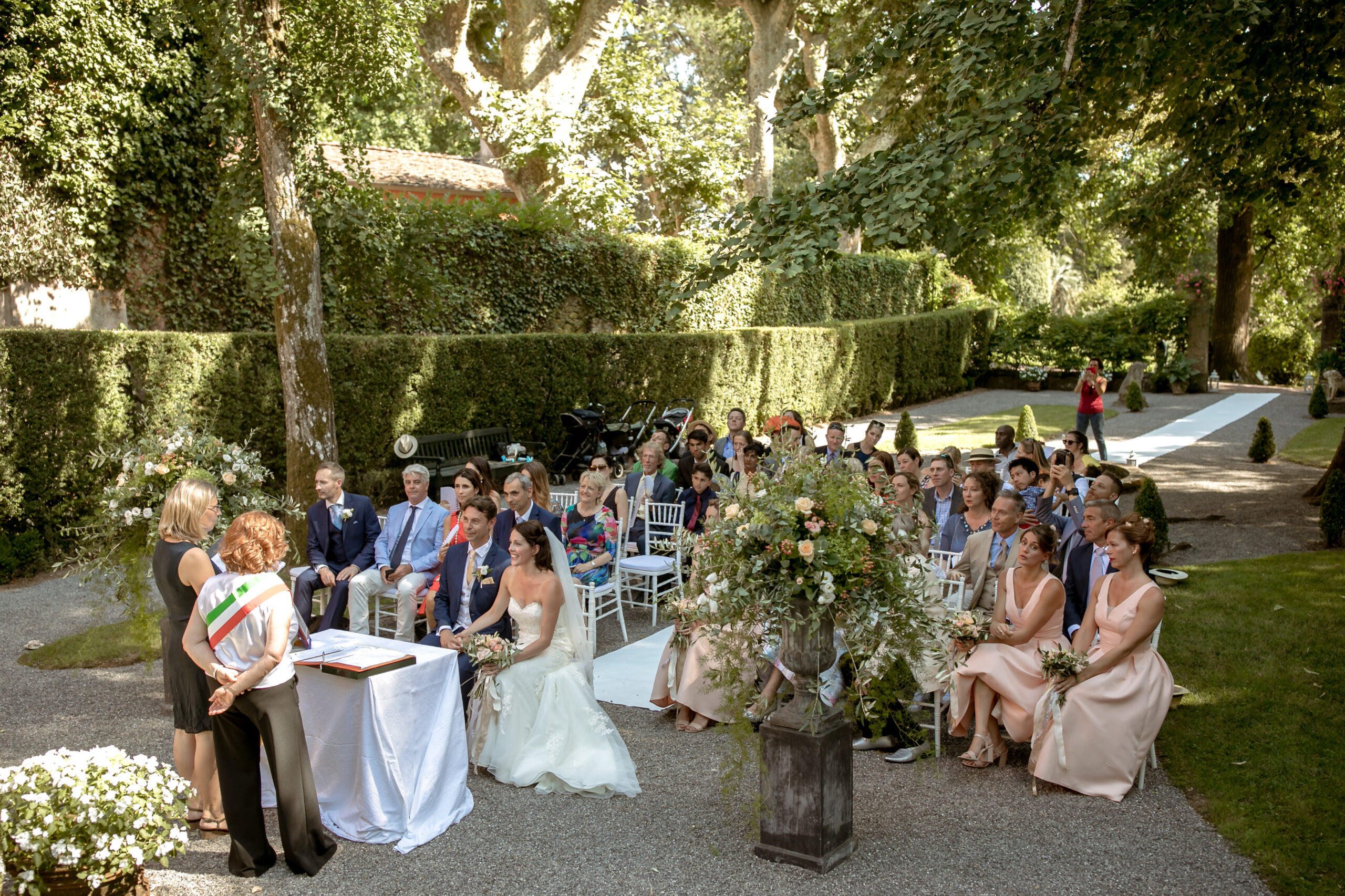 ceremony in the shaded garden at the villa